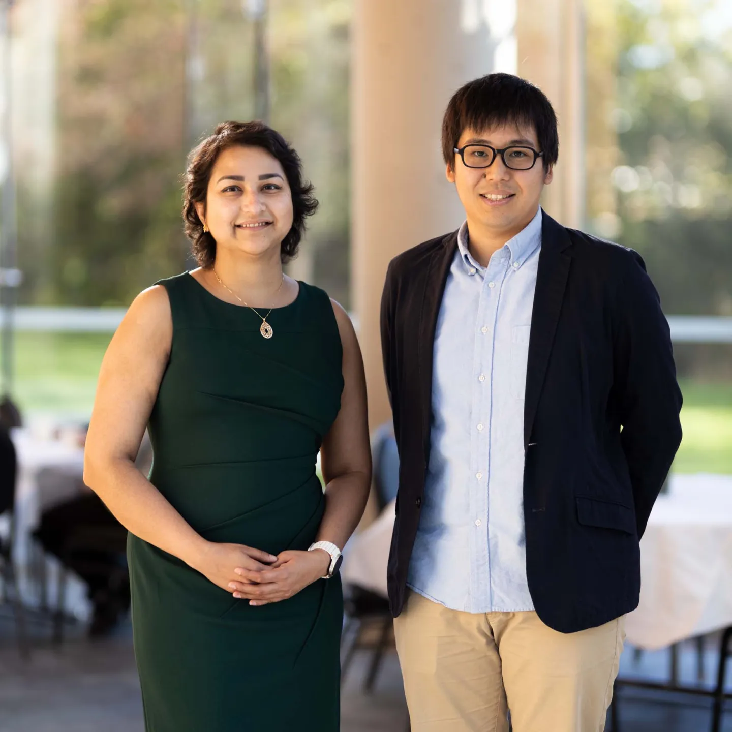 Junichi Okada and Rabia Khawaja winners posing for photo in atrium