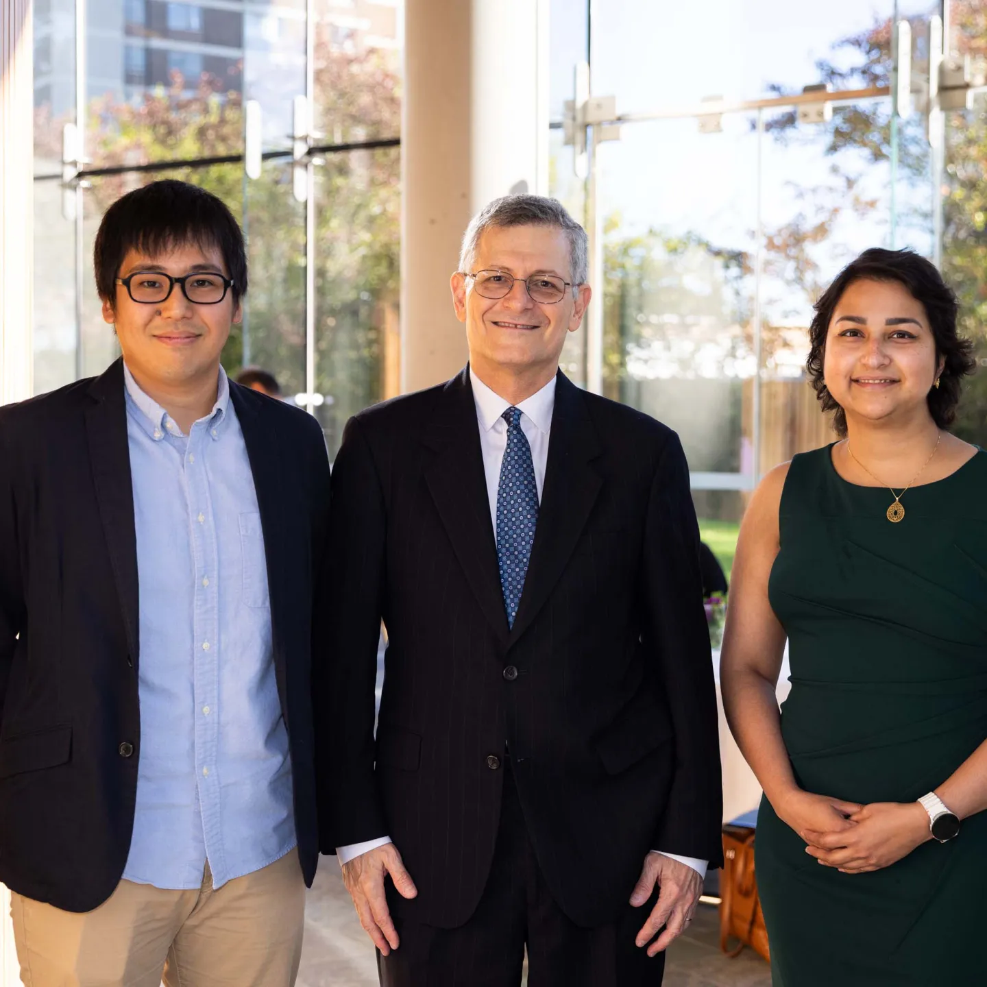 Dean Yaron Tomor, Junichi Okada and Rabia Khawaja pose for photo in atrium