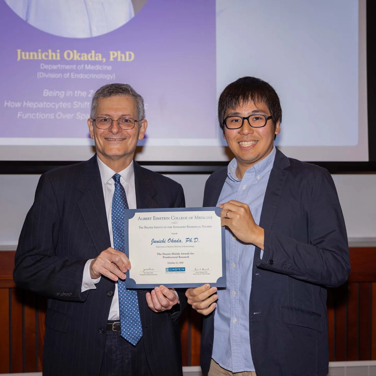 Dean Yaron Tomer and Junichi Okada photo with certificate in Lefrak Auditorium