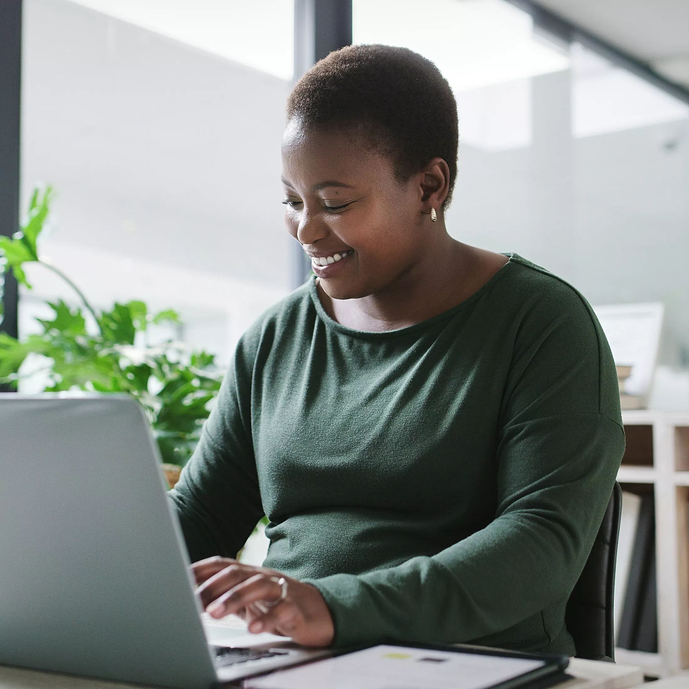 Woman at Laptop with Plants