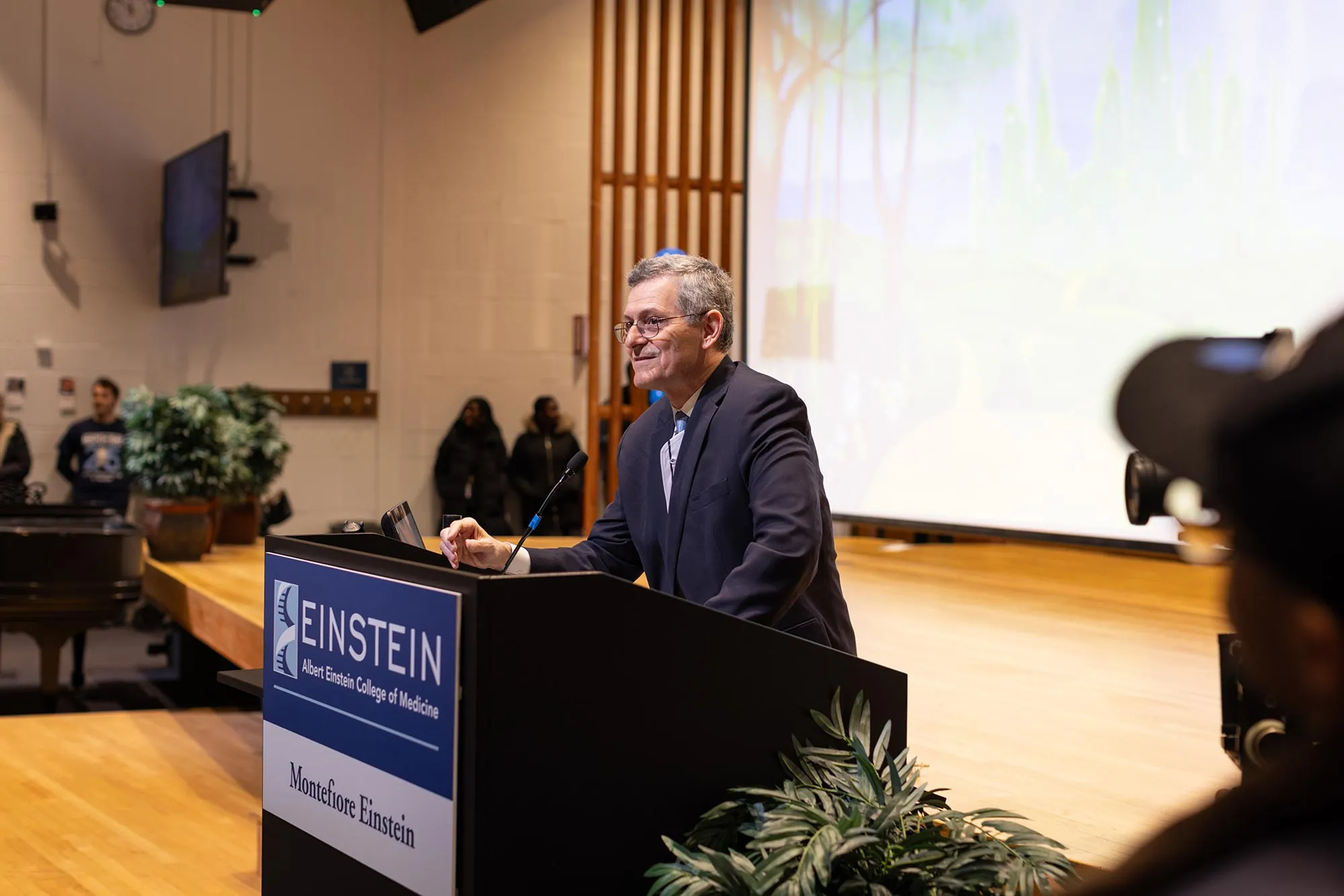 Dr. Yaron Tomer at the podium in Robbins Auditorium
