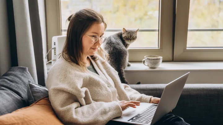 Woman on Laptop with Cat