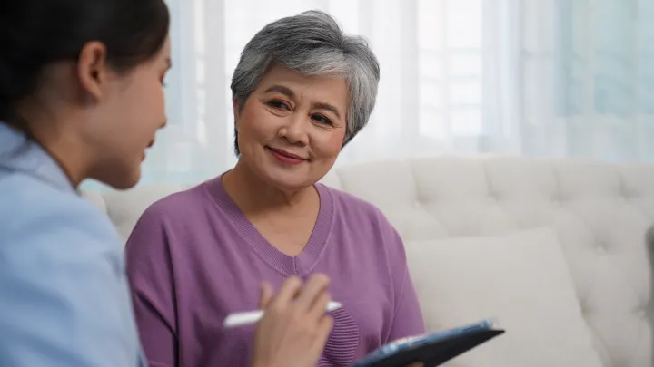 Elderly woman conducting business