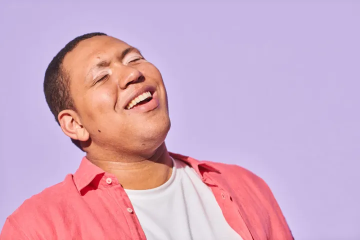 Smiling Man in Salmon colored Shirt